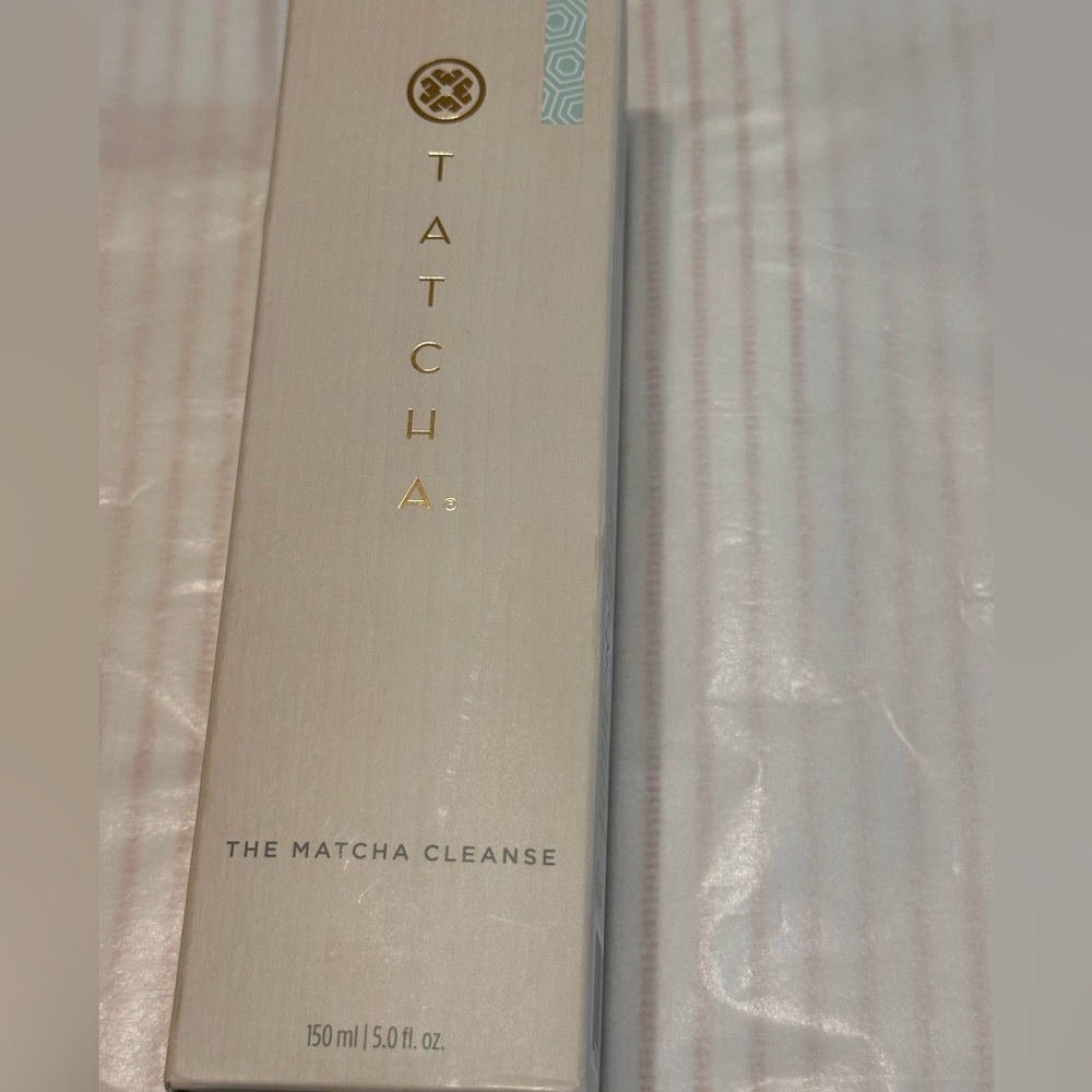 Tatcha Skincare Packaging with Cream and Gold Accents